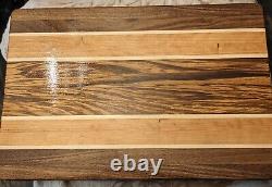 Planche à découper en bois exotique à grains de bordure fait main